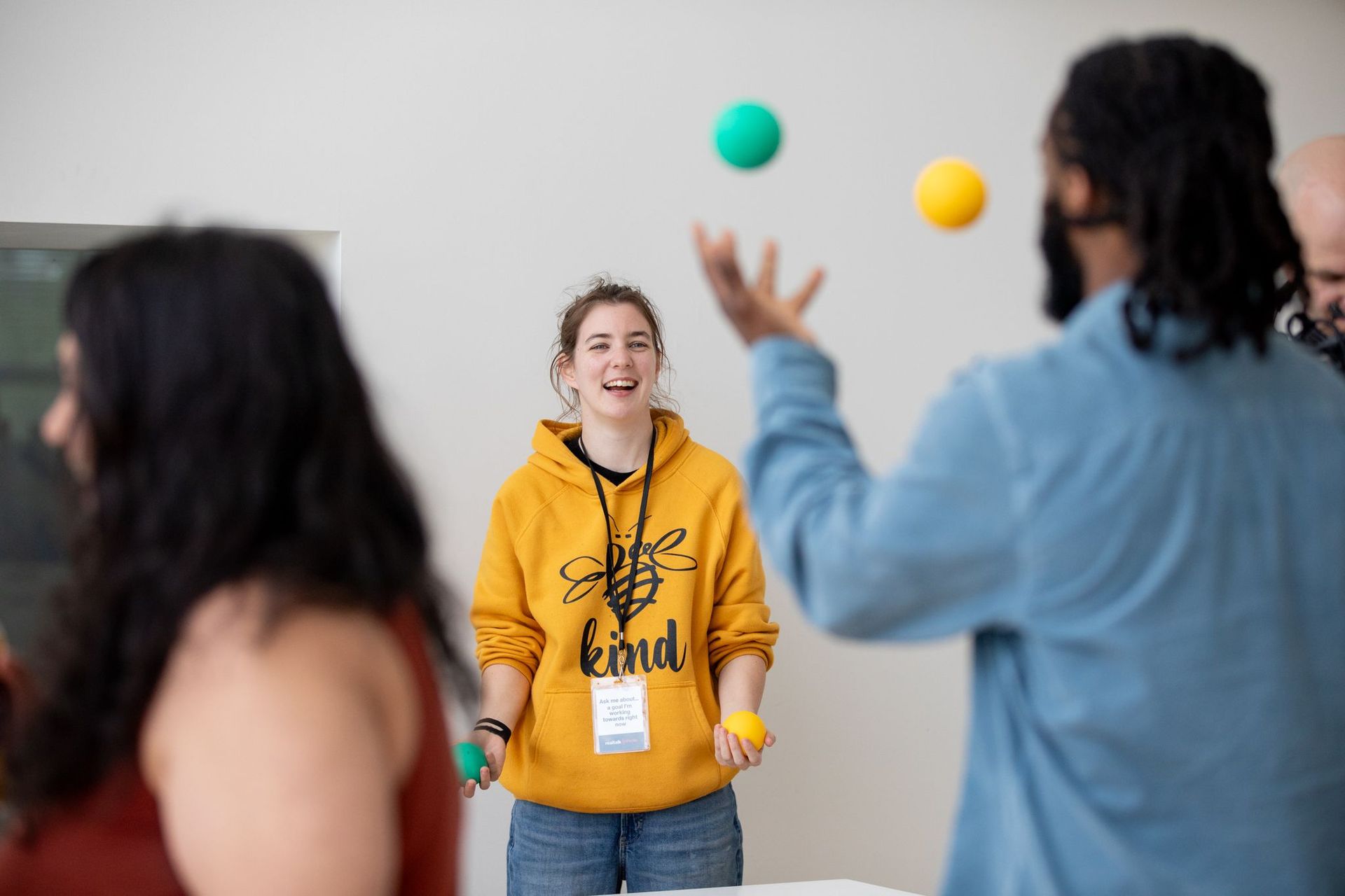 Abbi Wilson laughing while teaching juggling